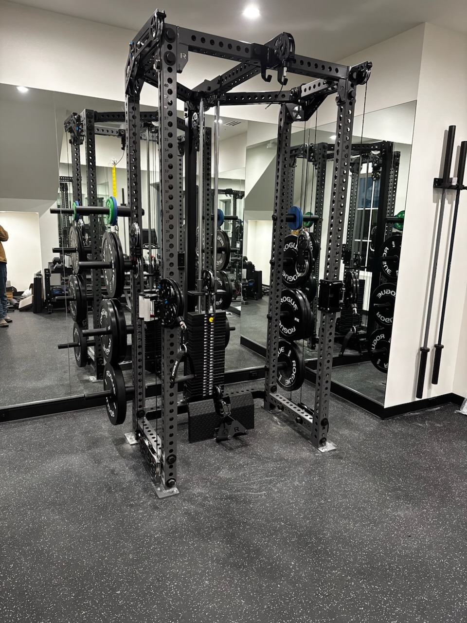 A home gym power cage assembled and ready to use
